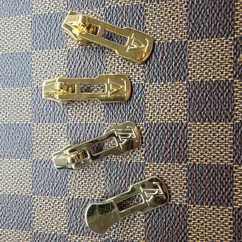 Gold Zipper Pulls by Louis Vuitton